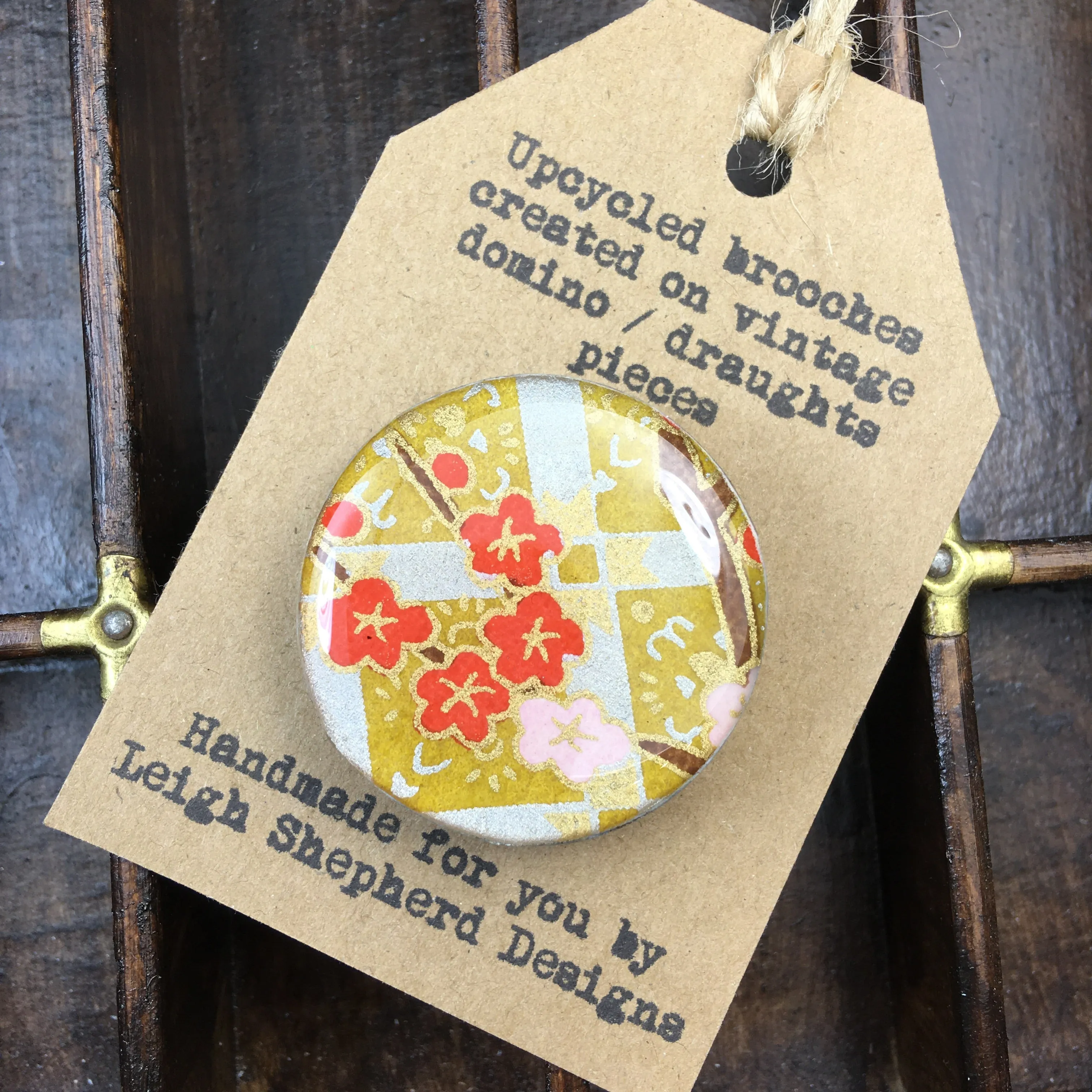 Elegant Gold Brooch Inspired by Draughts Game Piece Design